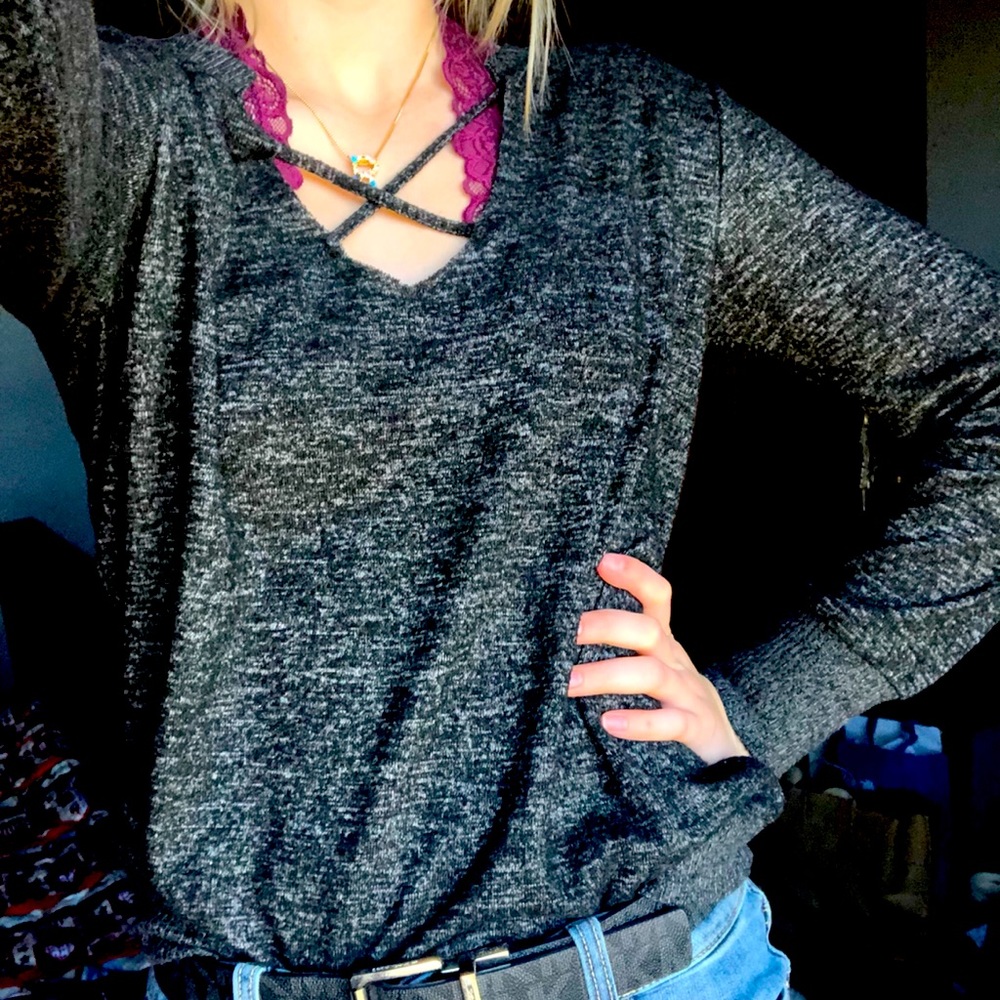 Black sweater with cross front.